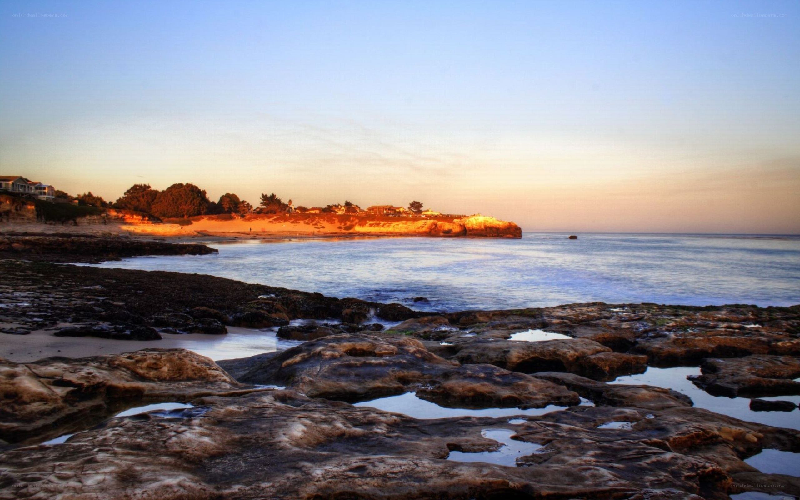 sunset at rocky coastal beach