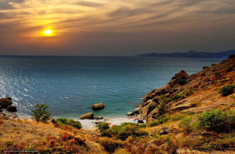 Sunset at rocky coastal cove