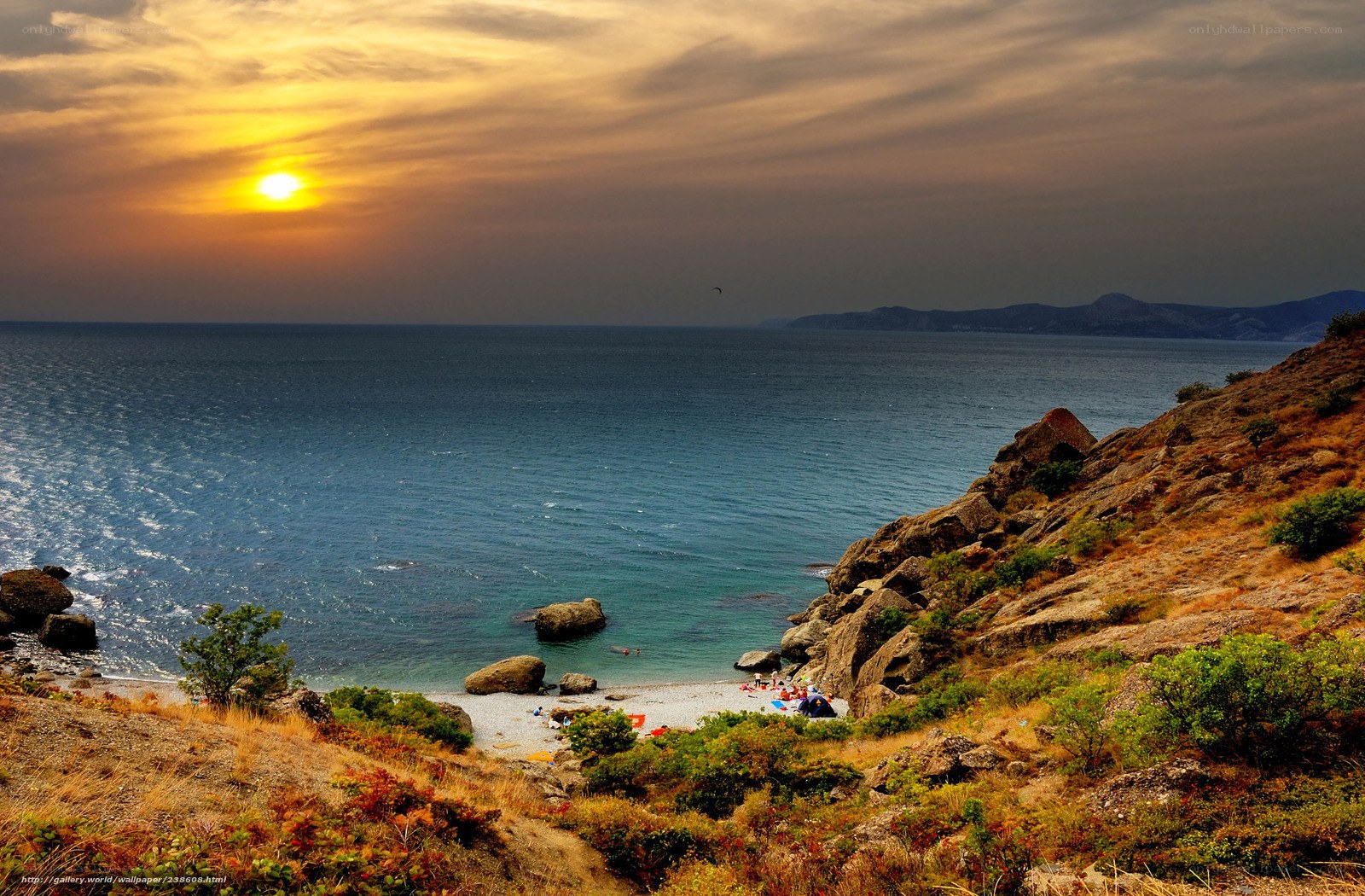 Sunset at rocky coastal cove