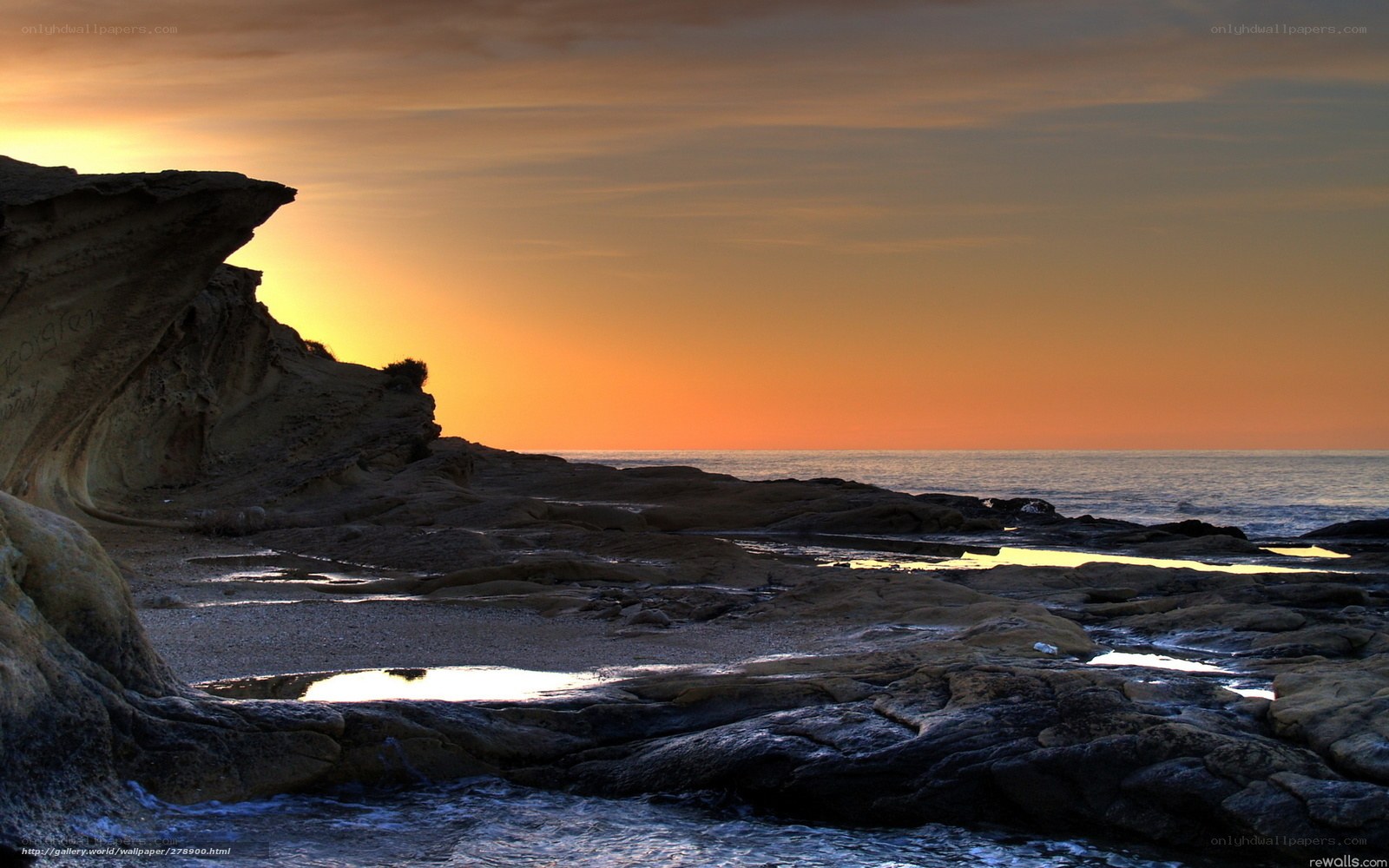 Sunset at rocky coastline