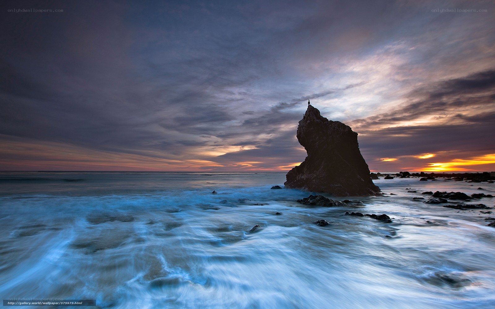 Sunset at rocky coastline