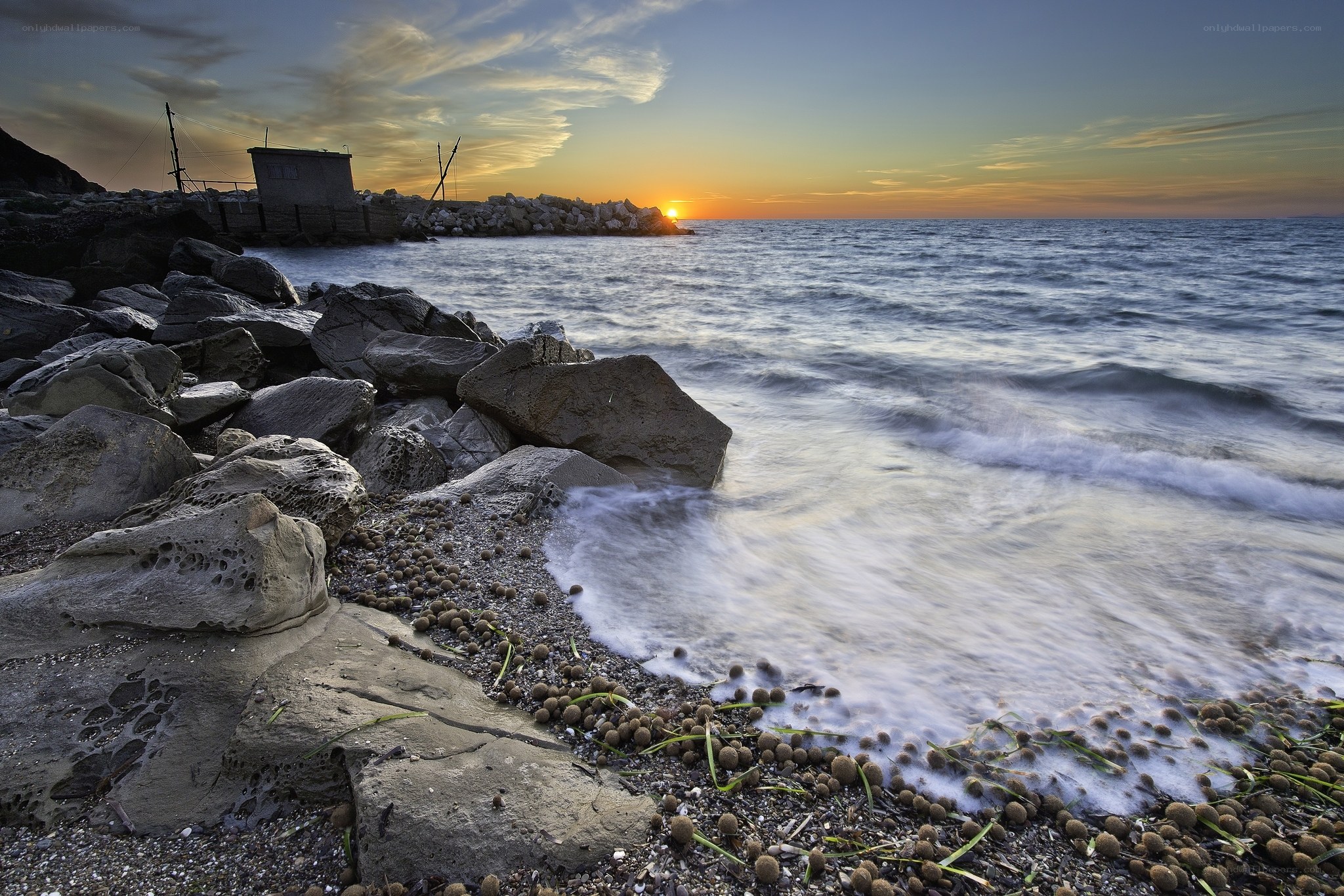 Sunset at rocky coastline