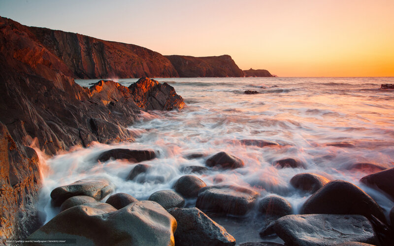Sunset at rocky coastline
