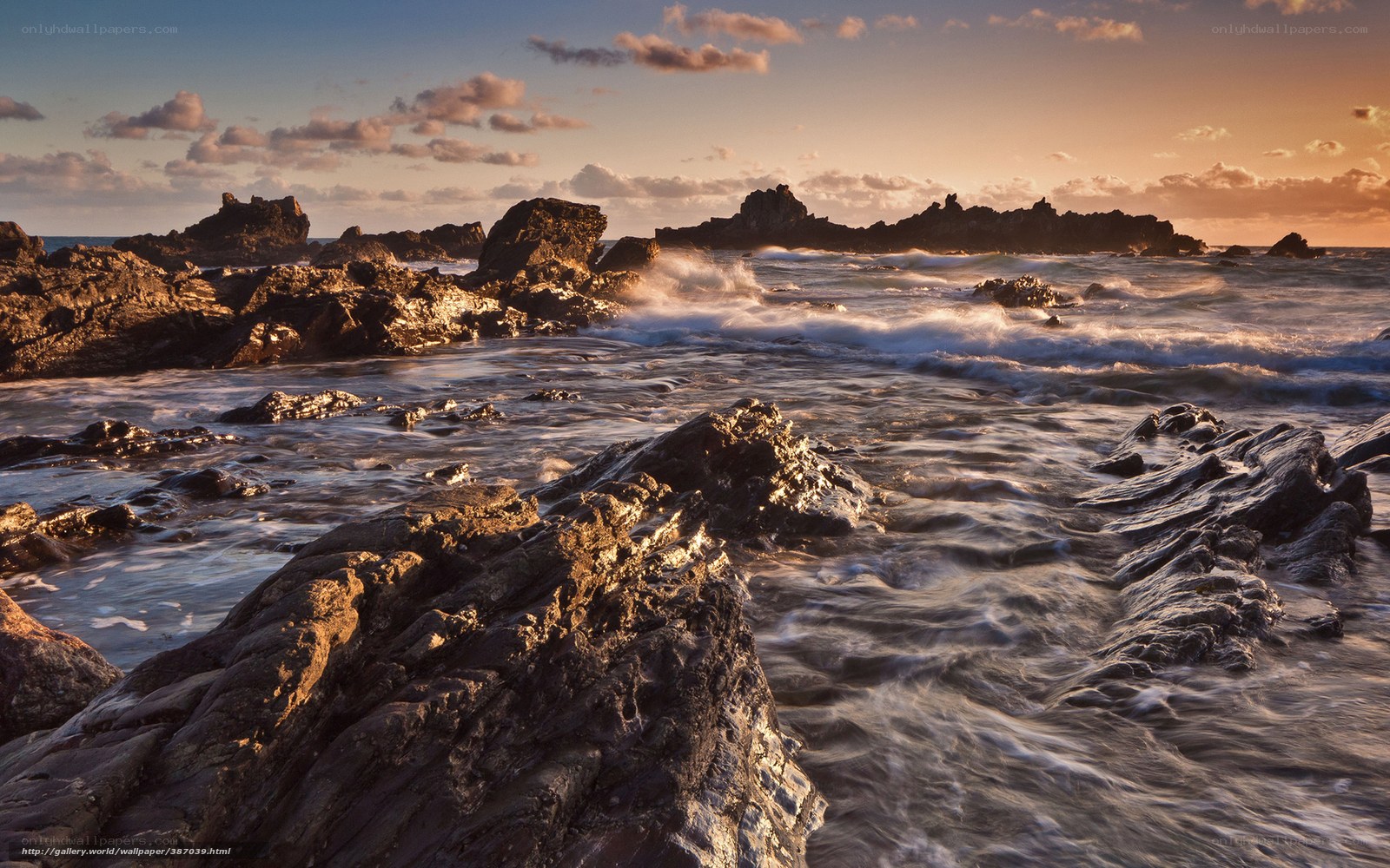 Sunset at rocky coastline