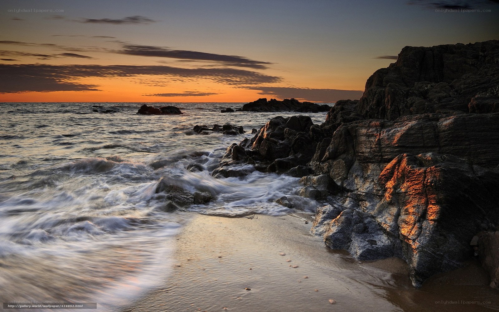 Sunset at rocky coastline