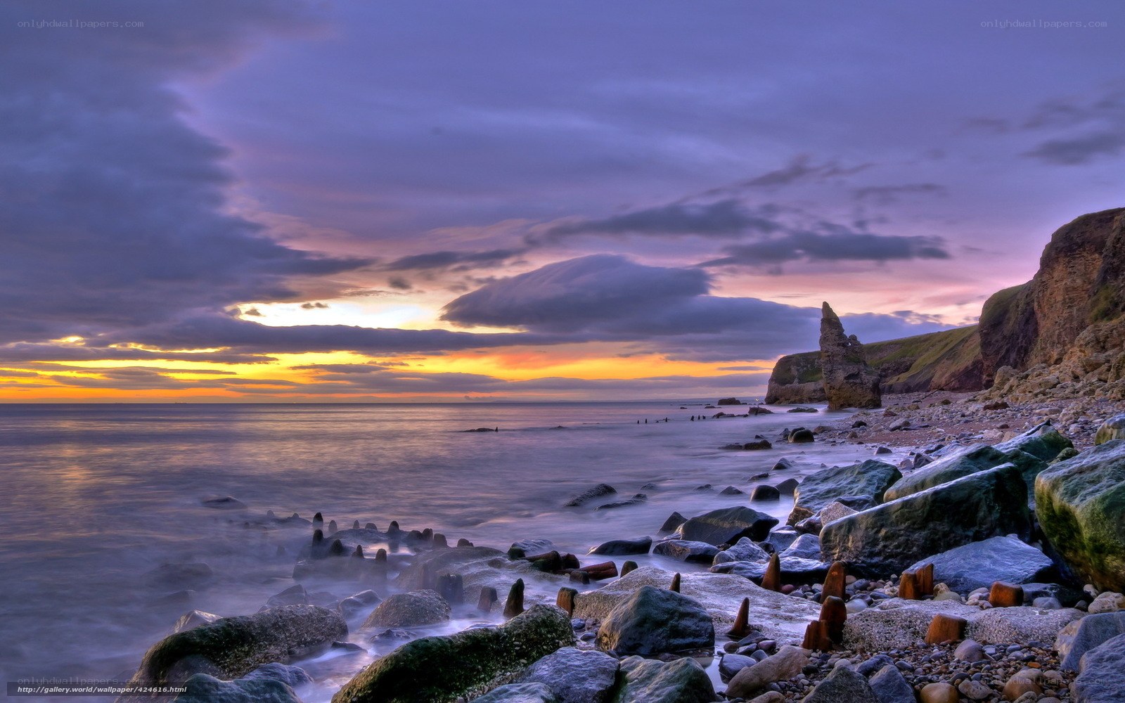 Sunset at rocky coastline