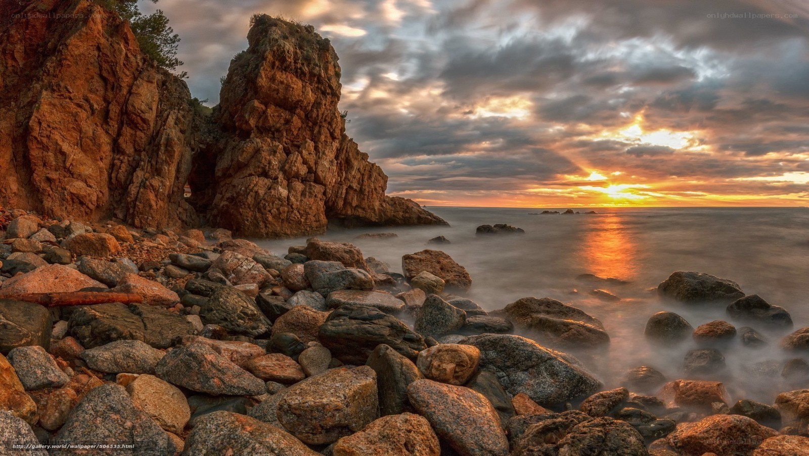 Sunset at rocky coastline