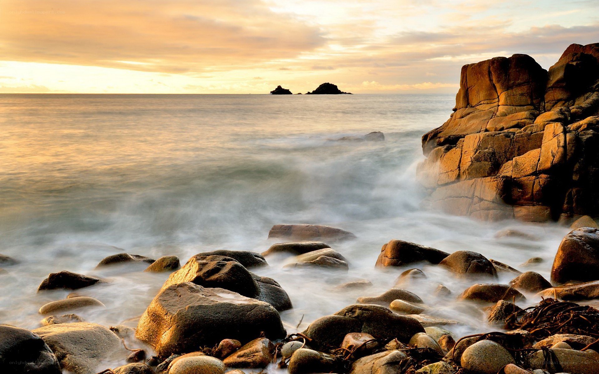 Sunset at rocky coastline