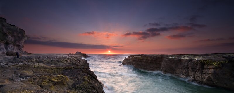 Sunset at rocky coastline