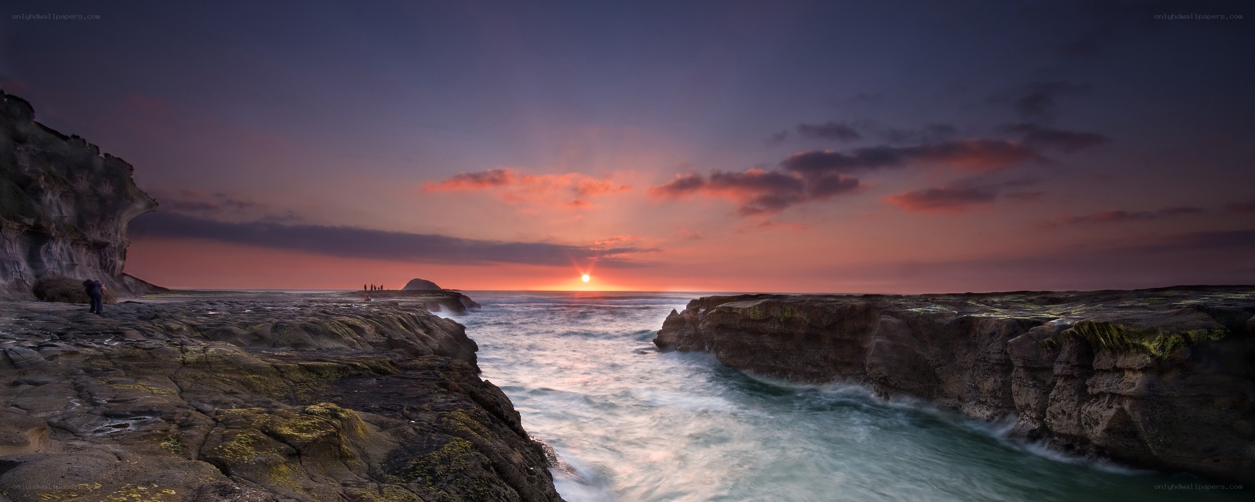 Sunset at rocky coastline