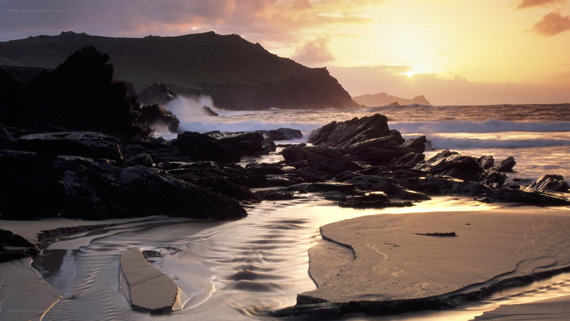 Sunset at rocky coastline