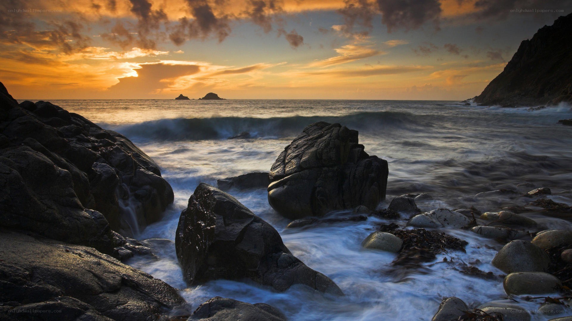 Sunset at rocky coastline