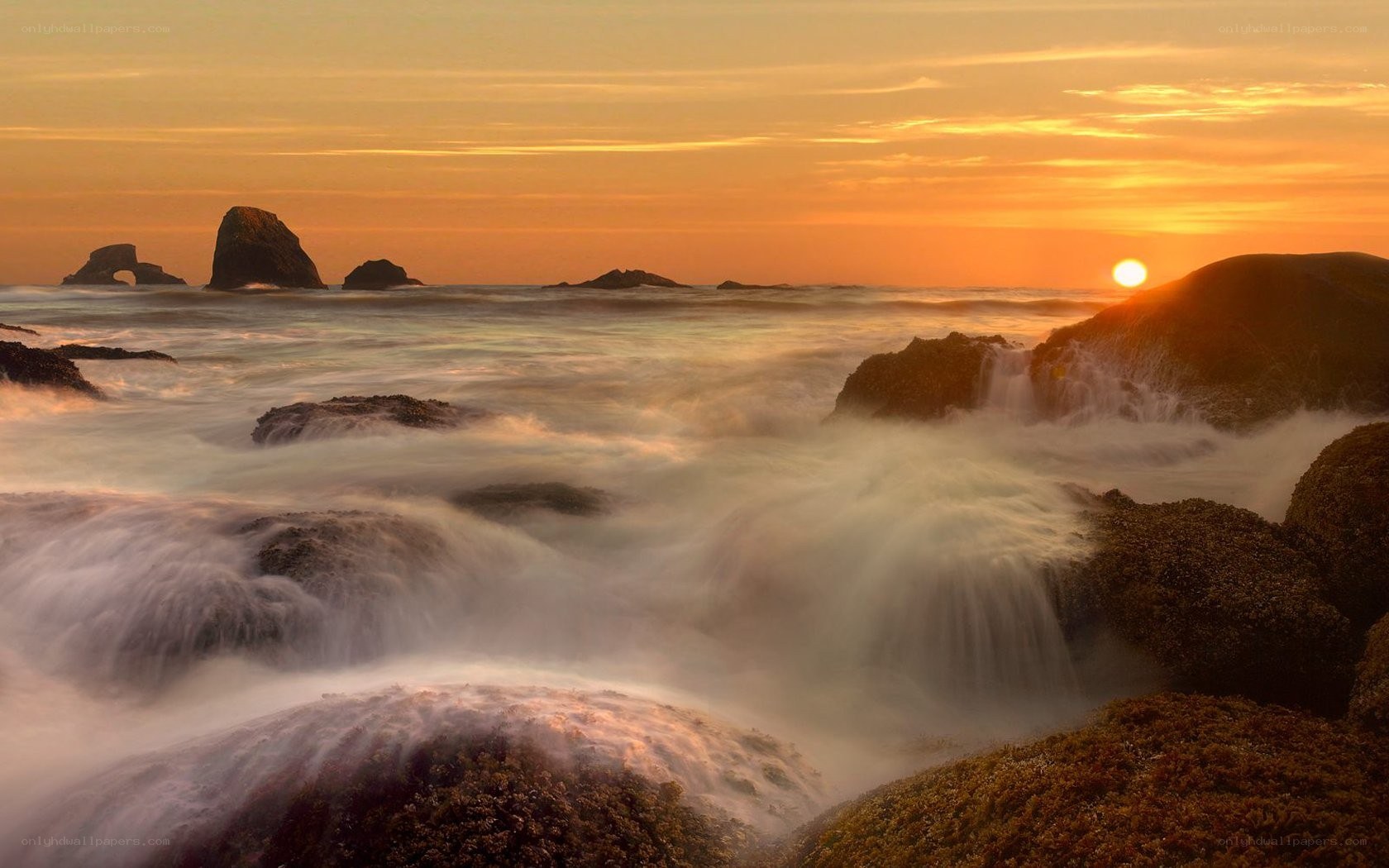 Sunset at rocky coastline