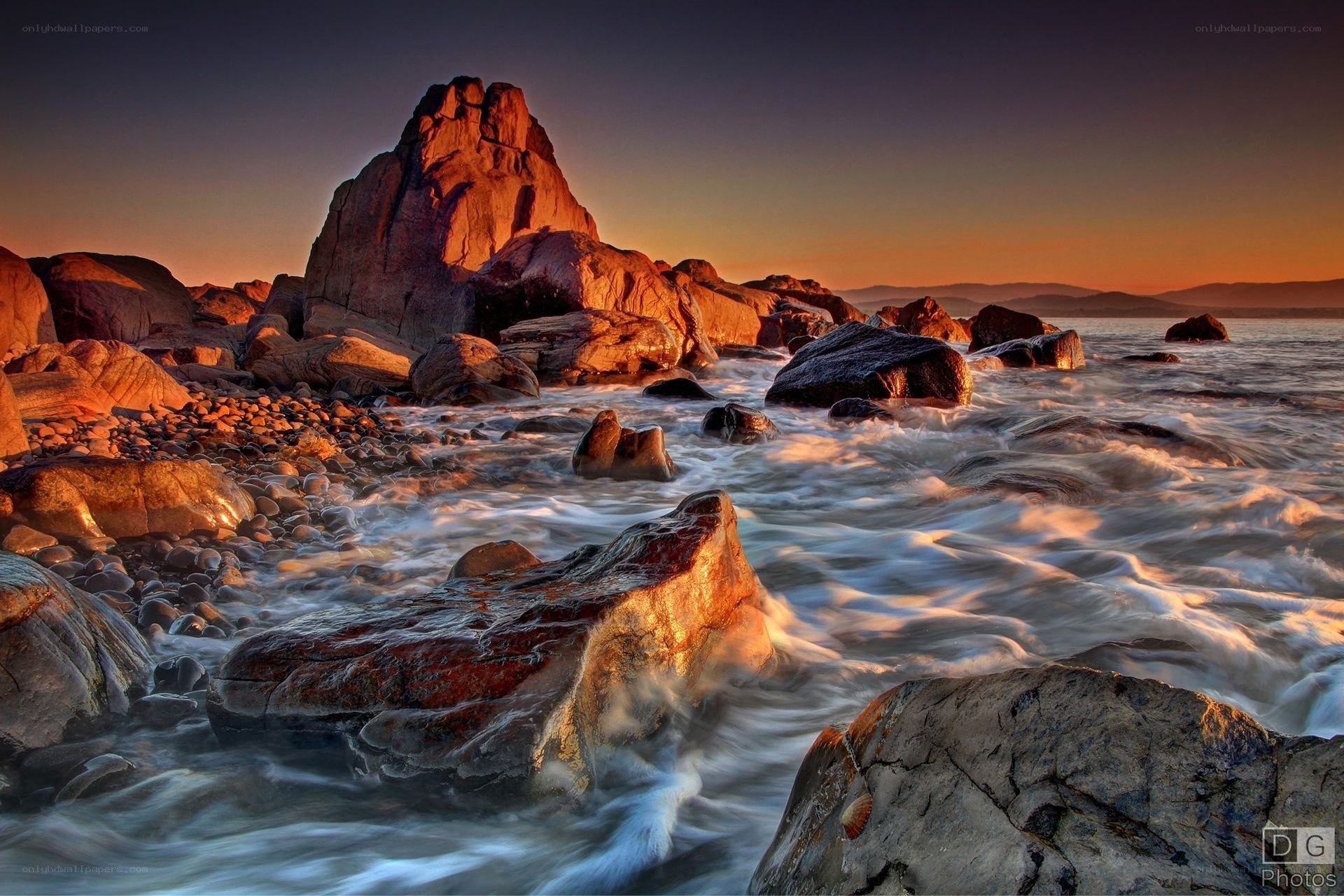 Sunset at rocky coastline