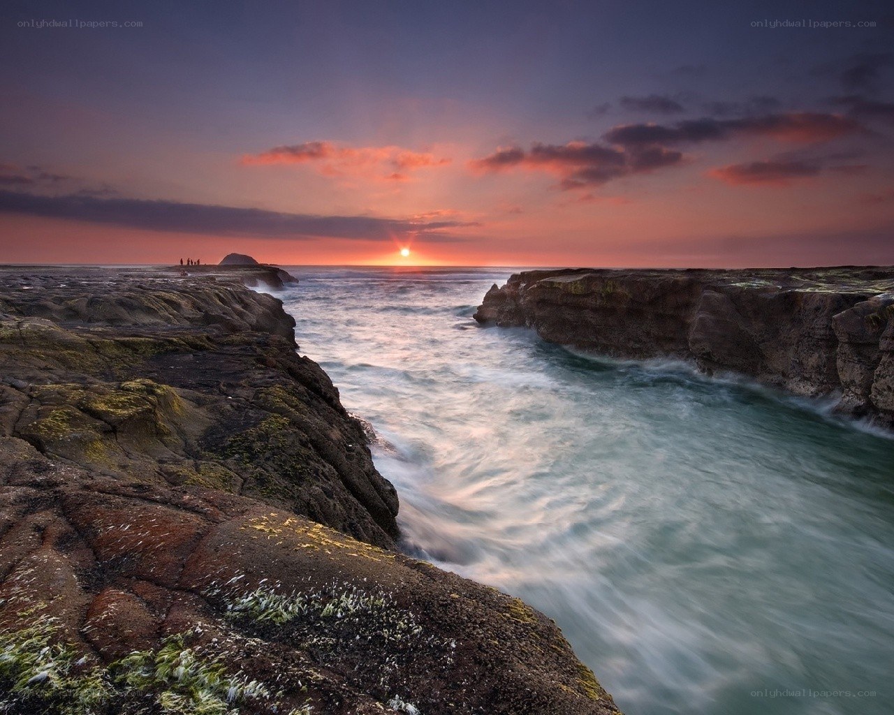 Sunset at rocky coastline