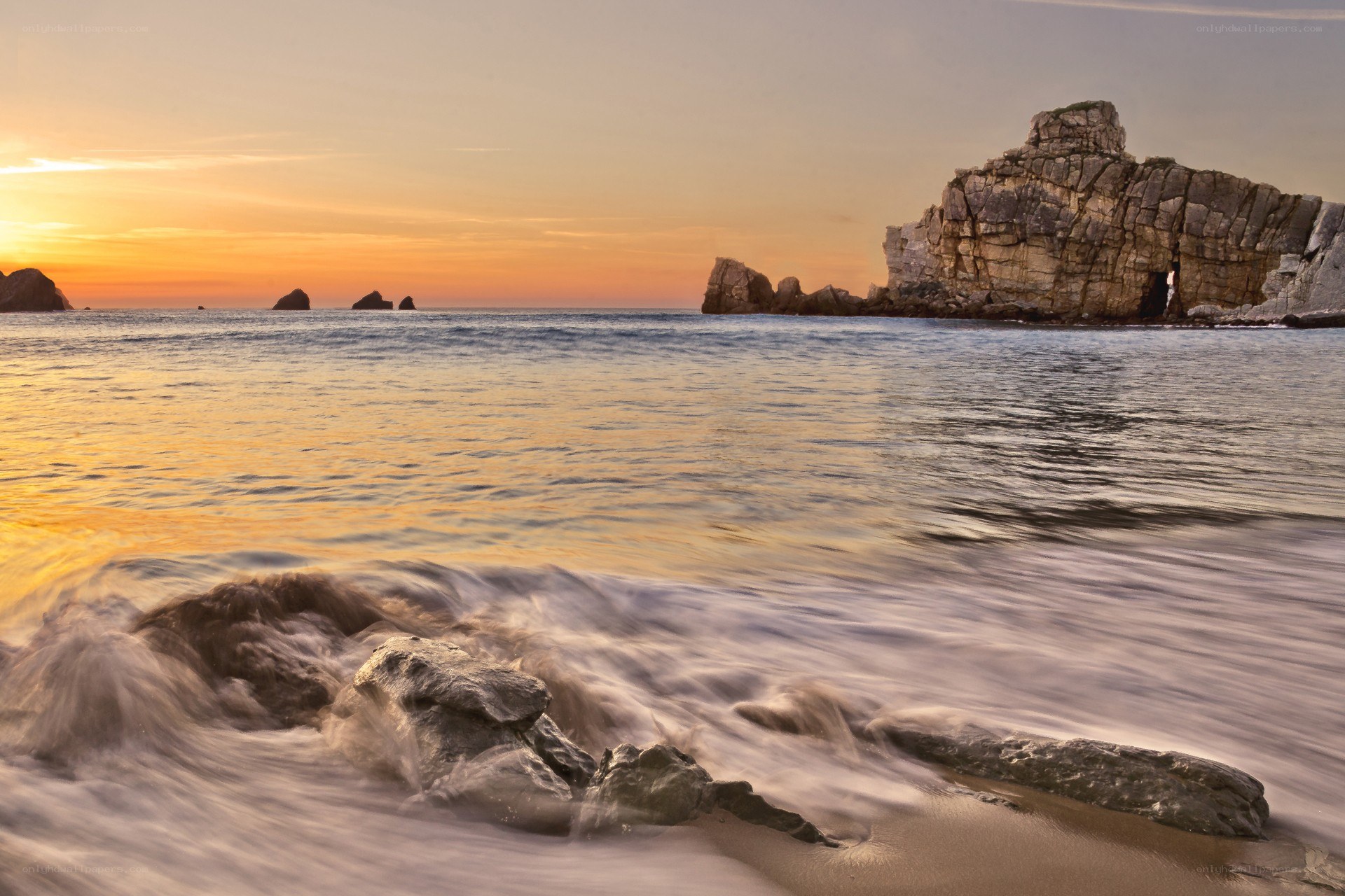 Sunset at rocky coastline