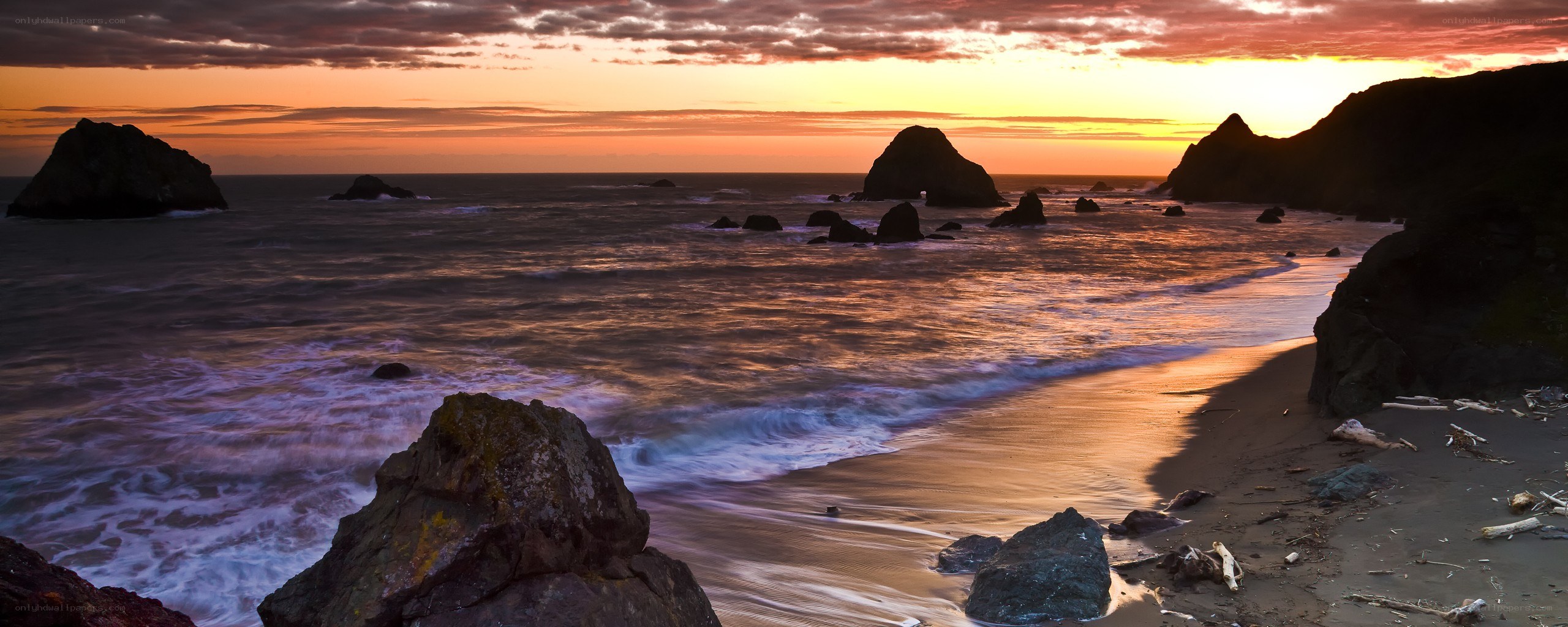sunset at rocky coastline