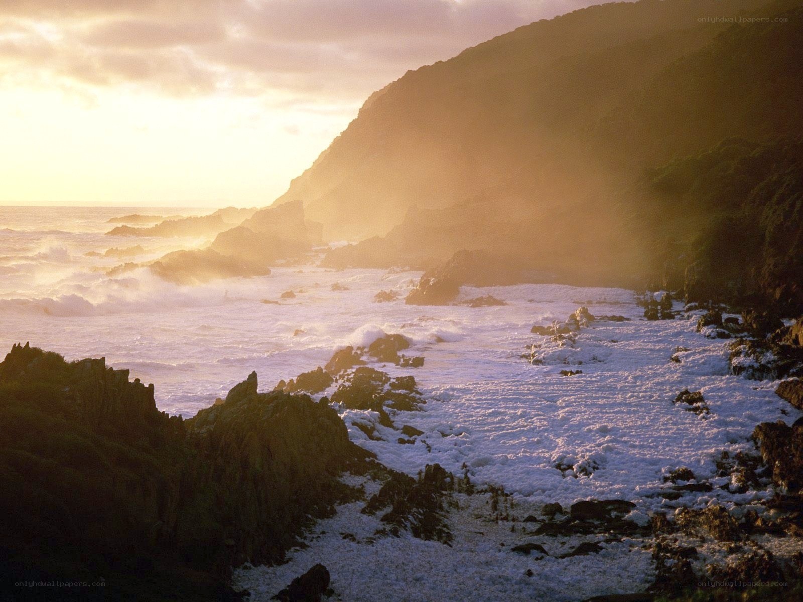 Sunset at rocky coastline