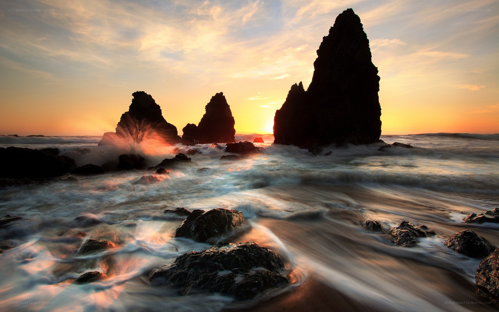 Sunset at rocky coastline
