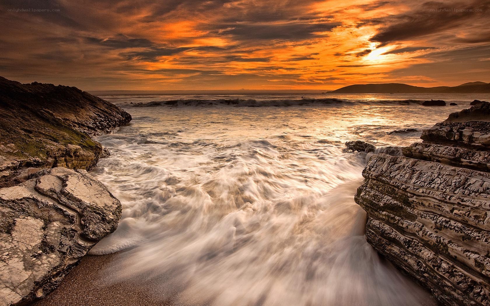 Sunset at rocky coastline