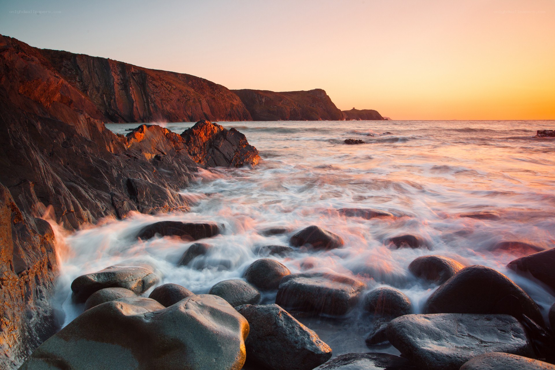 Sunset at rocky coastline