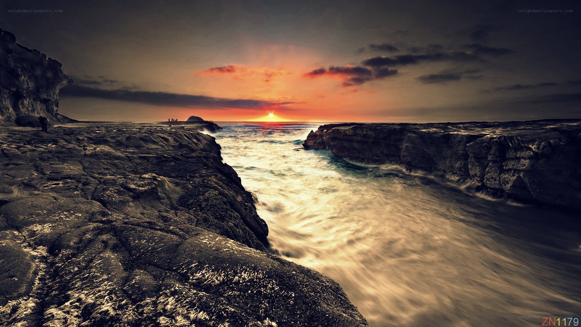 Sunset at rocky coastline