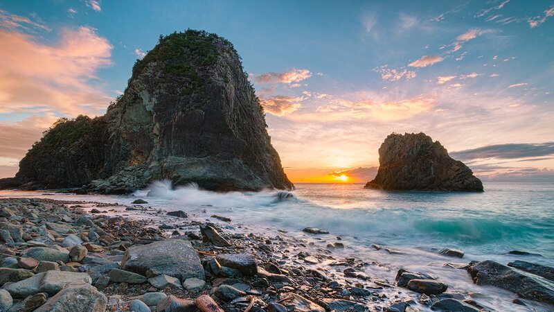 Sunset at rocky coastline