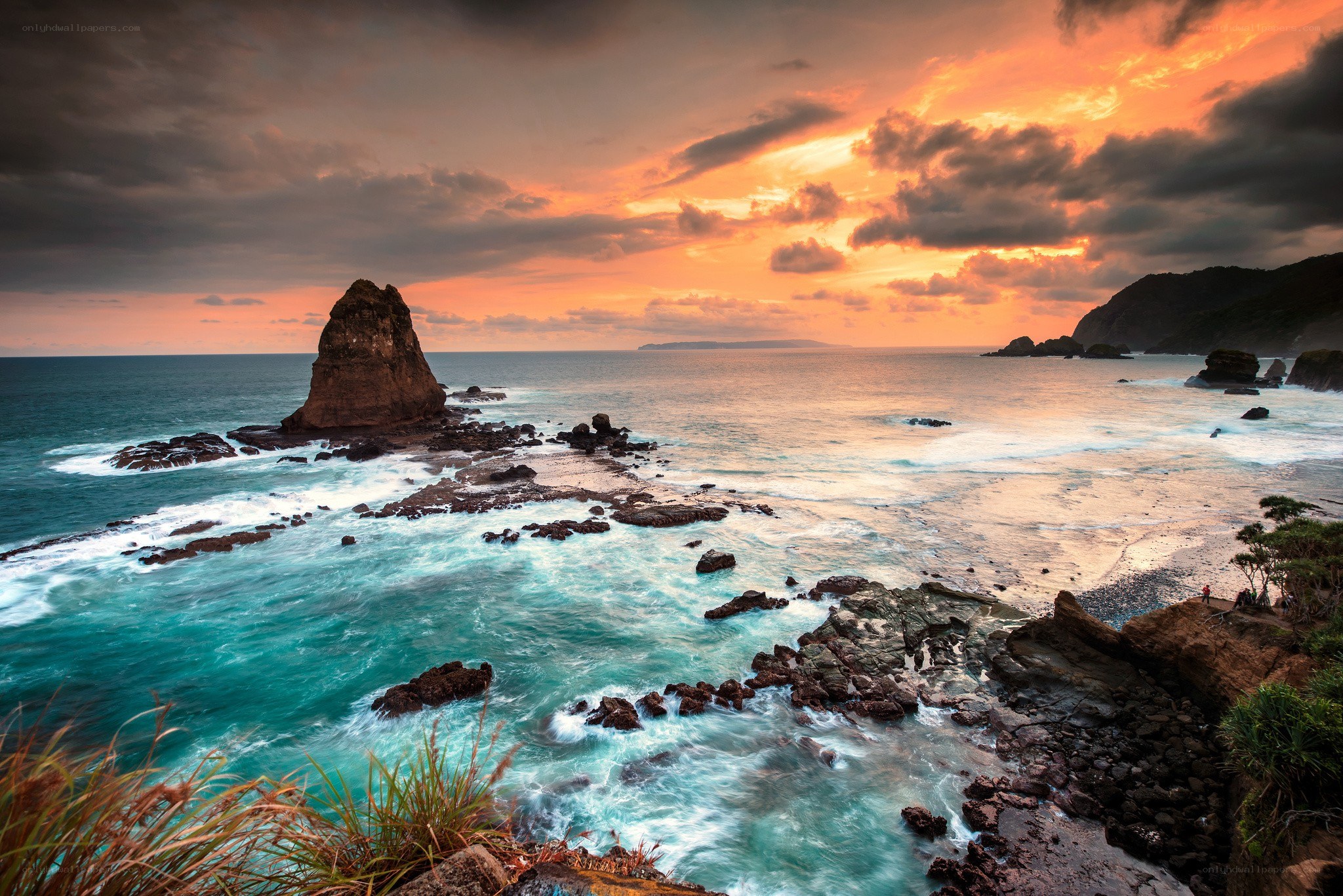 Sunset at rocky coastline
