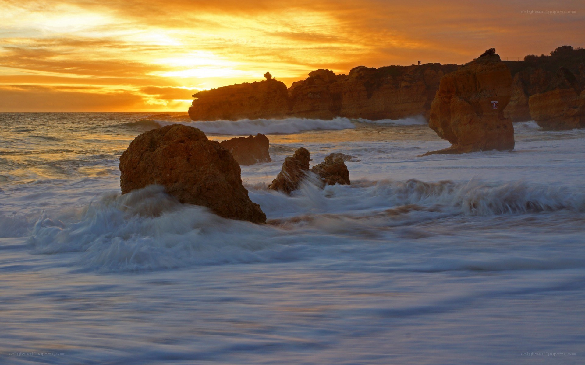 Sunset at rocky coastline
