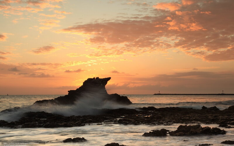 Sunset at rocky coastline