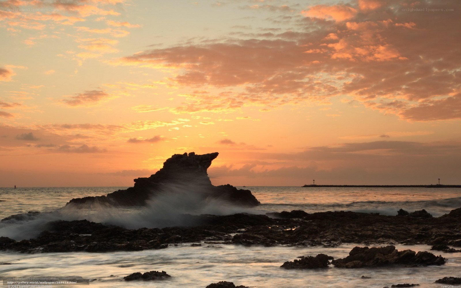 Sunset at rocky coastline