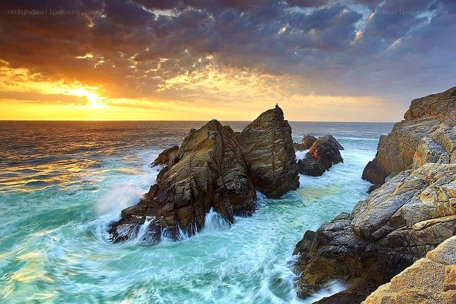 Sunset at rocky coastline