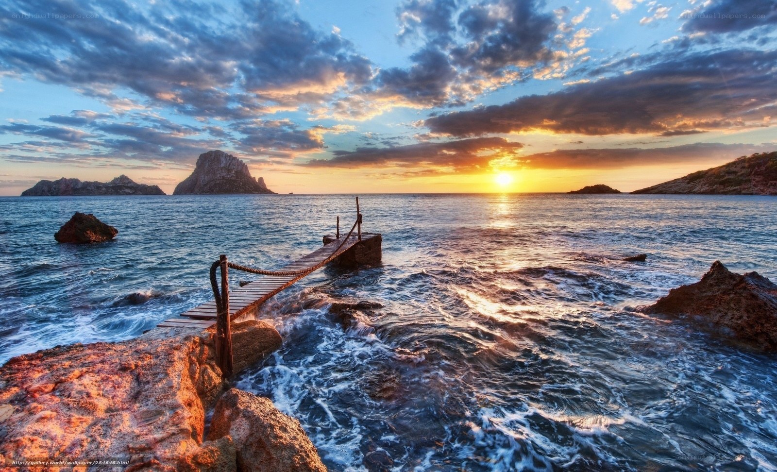 Sunset at rocky pier