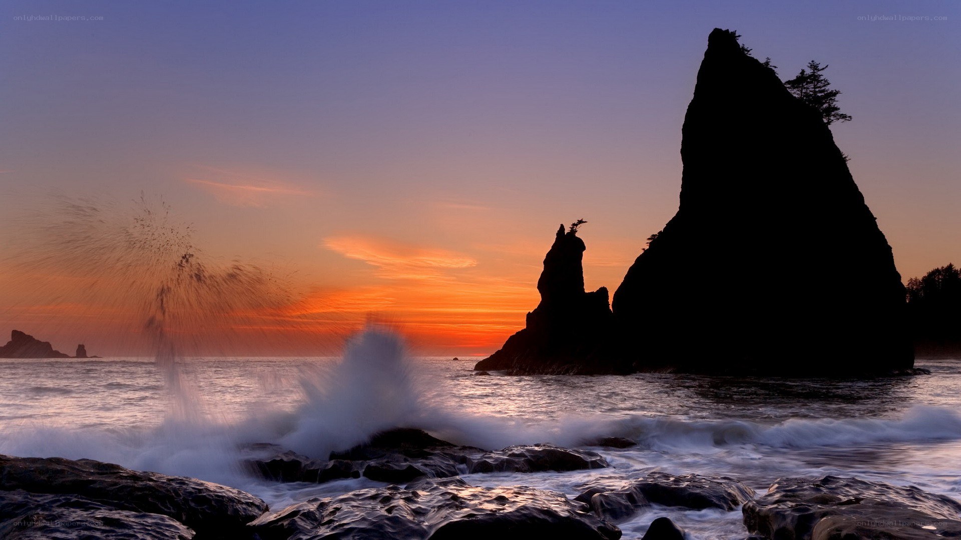 Sunset at sea with crashing waves