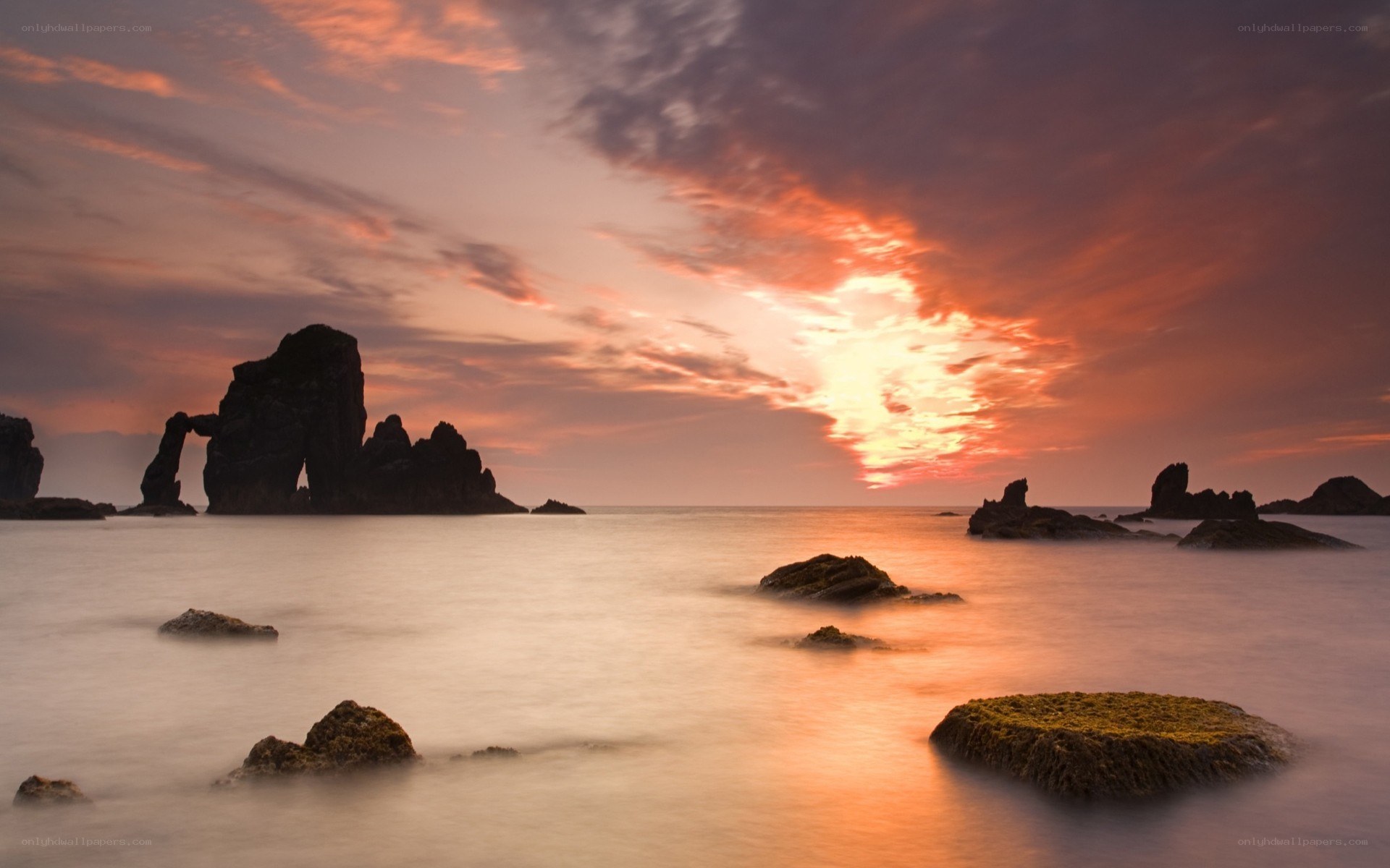 Sunset at sea with rock formations