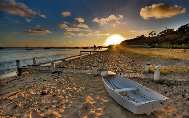 Sunset at the beach with a boat
