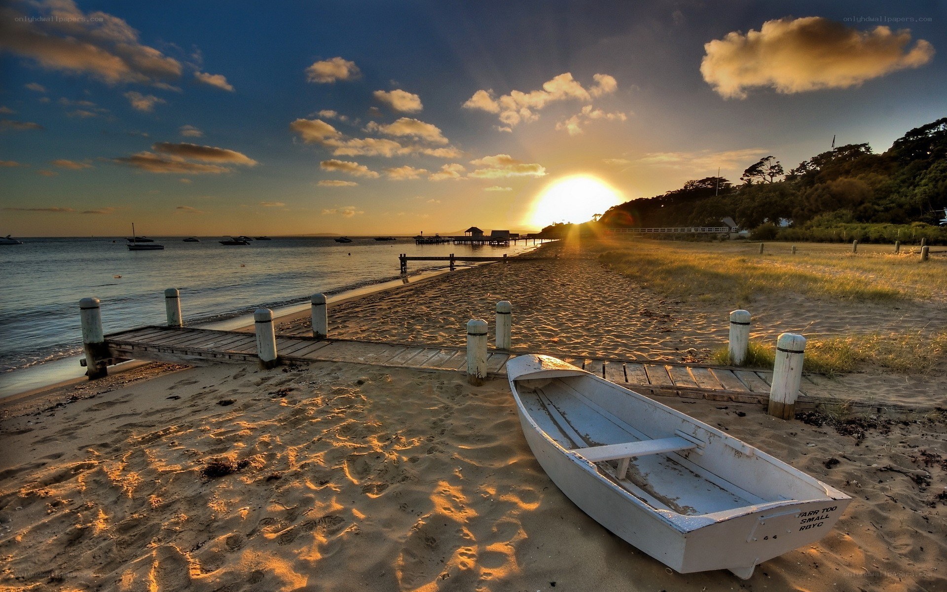 Sunset at the beach with a boat