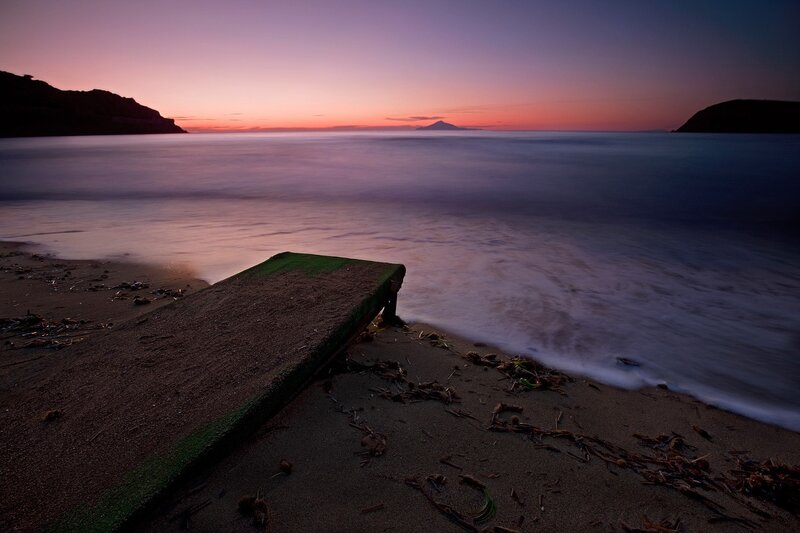 Sunset at the beach with a dock