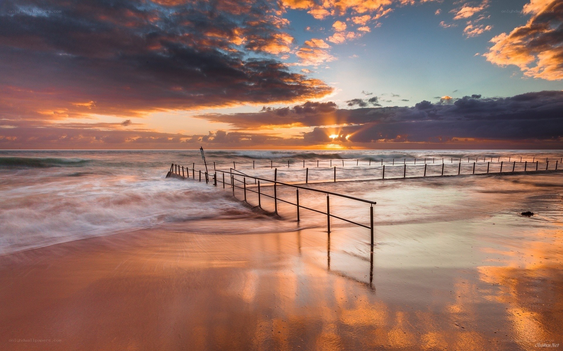 Sunset at the beach with a pier