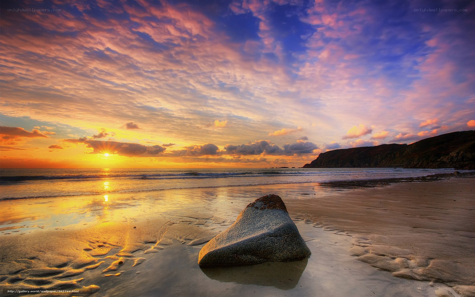 Sunset at the beach with a rock