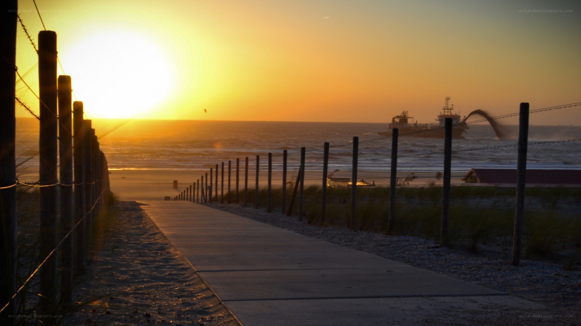 Sunset at the beach with a ship