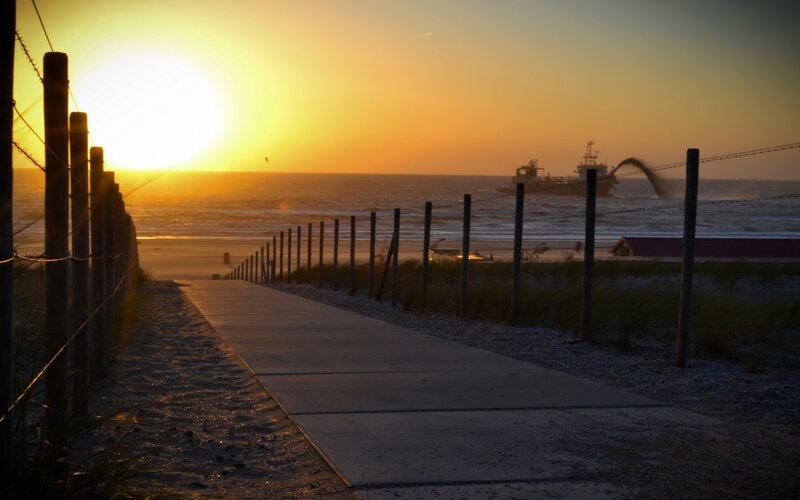 Sunset at the beach with a ship