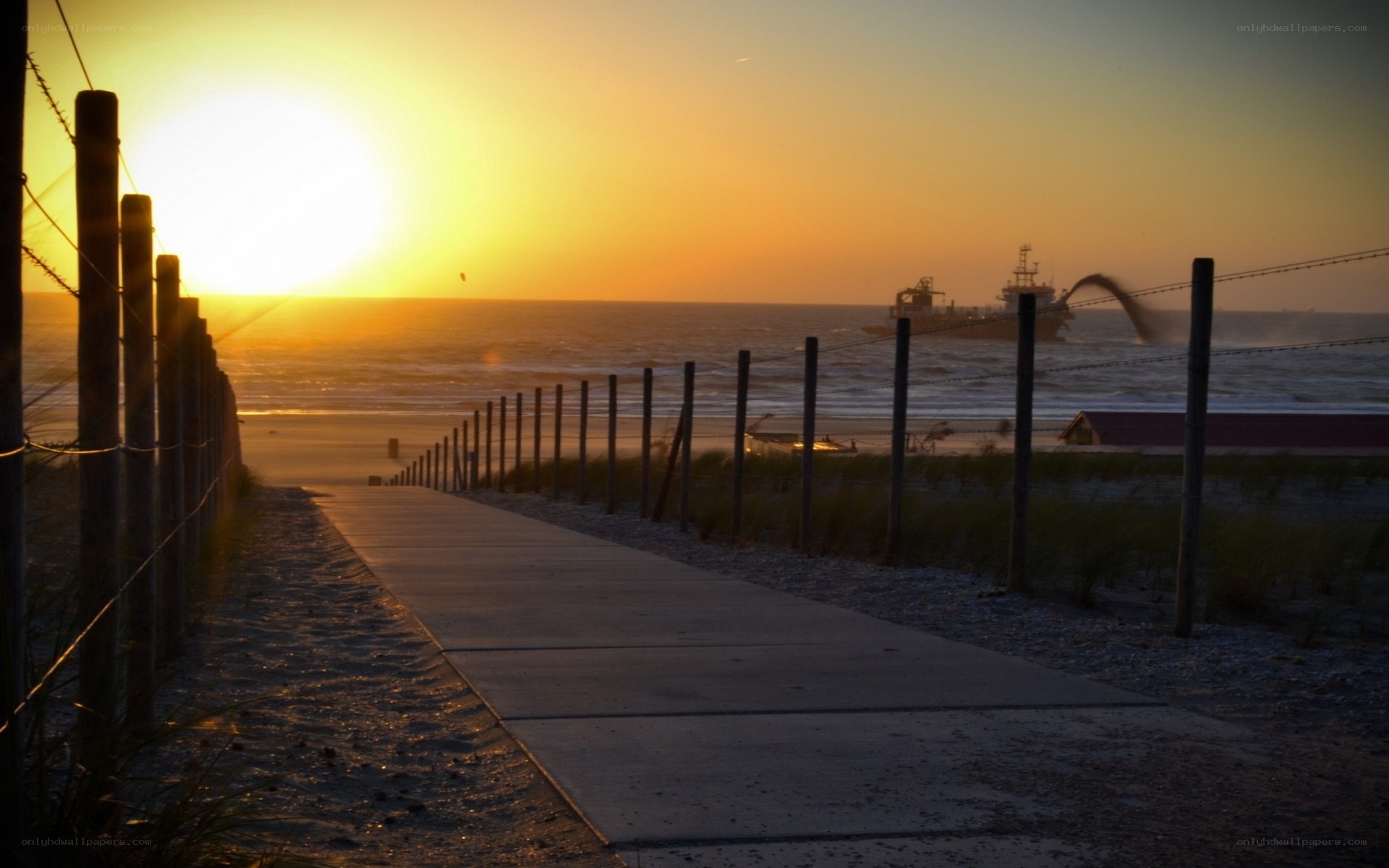 Sunset at the beach with a ship