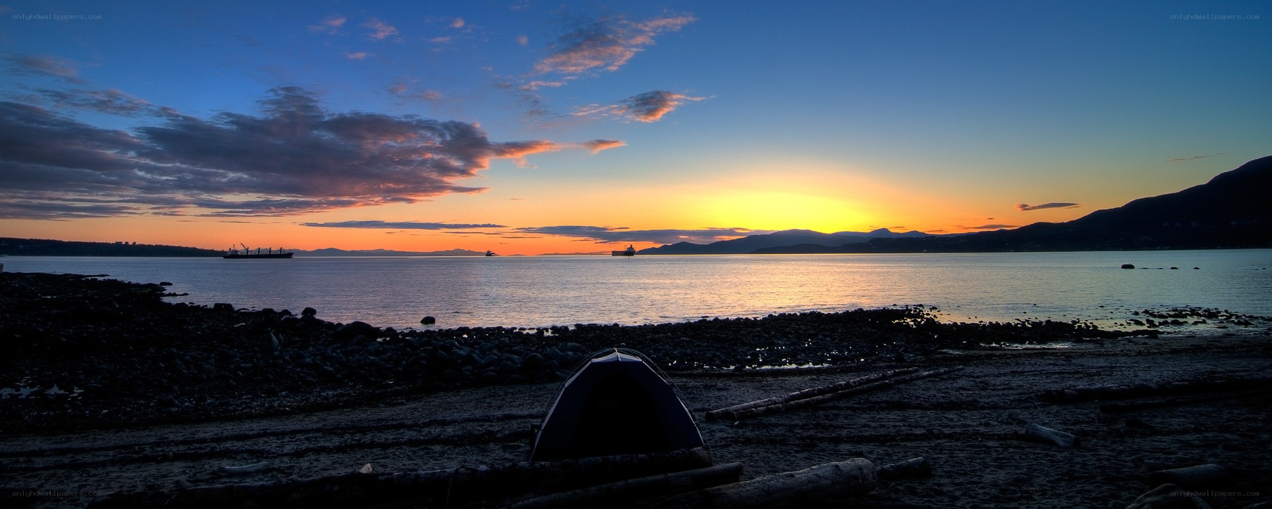 Sunset at the beach with a tent