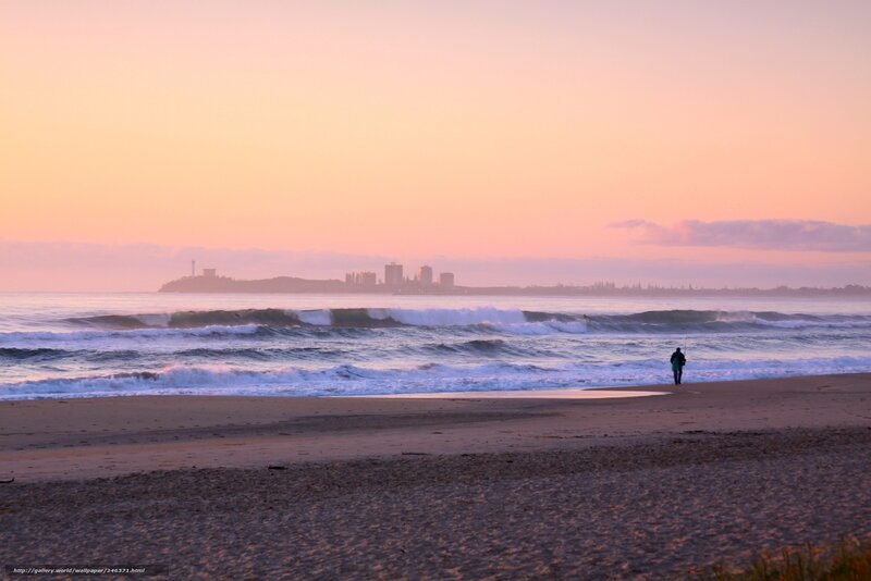 Sunset at the beach with city view