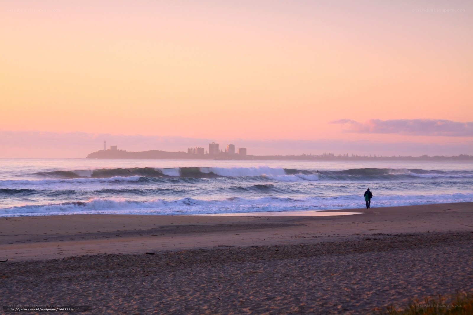 Sunset at the beach with city view