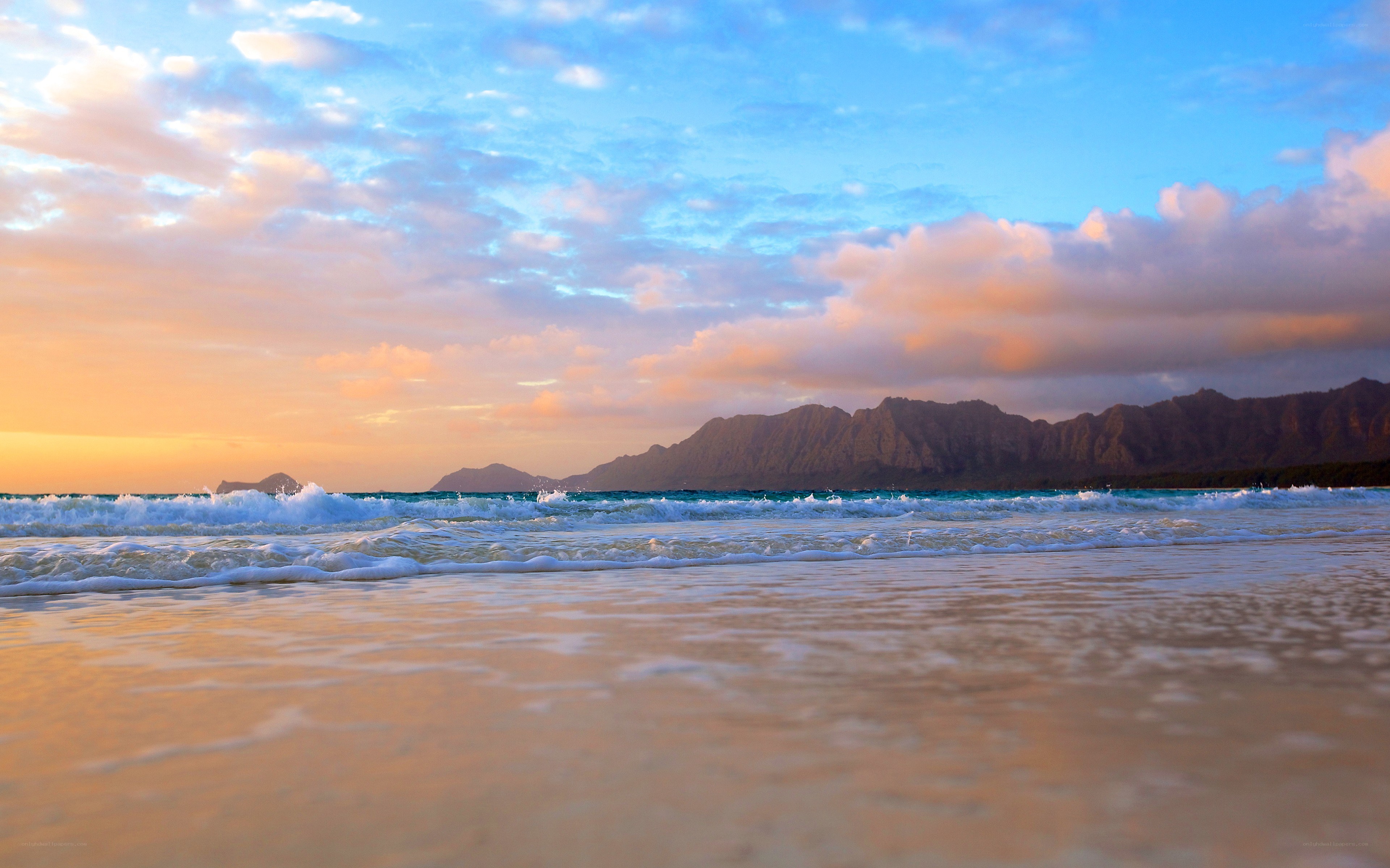 Sunset at the beach with mountains