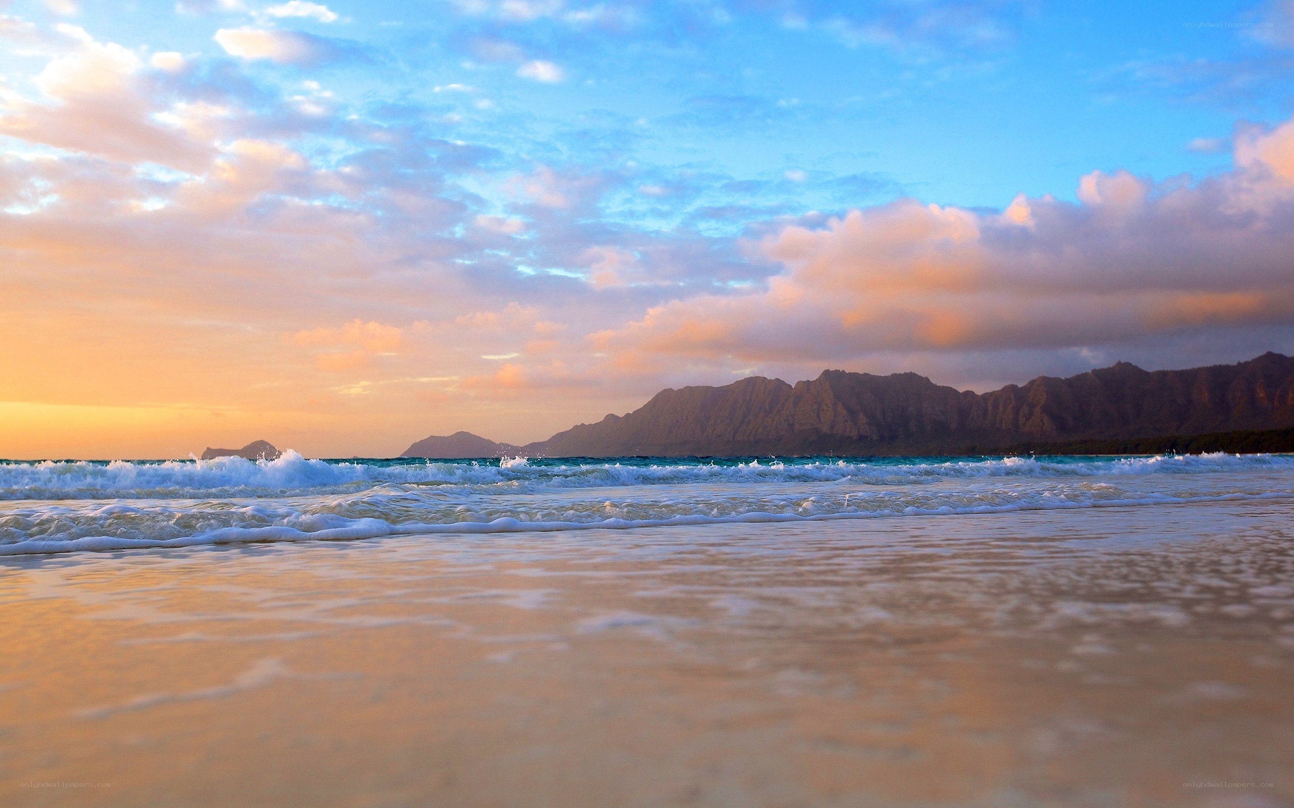 Sunset at the beach with mountains