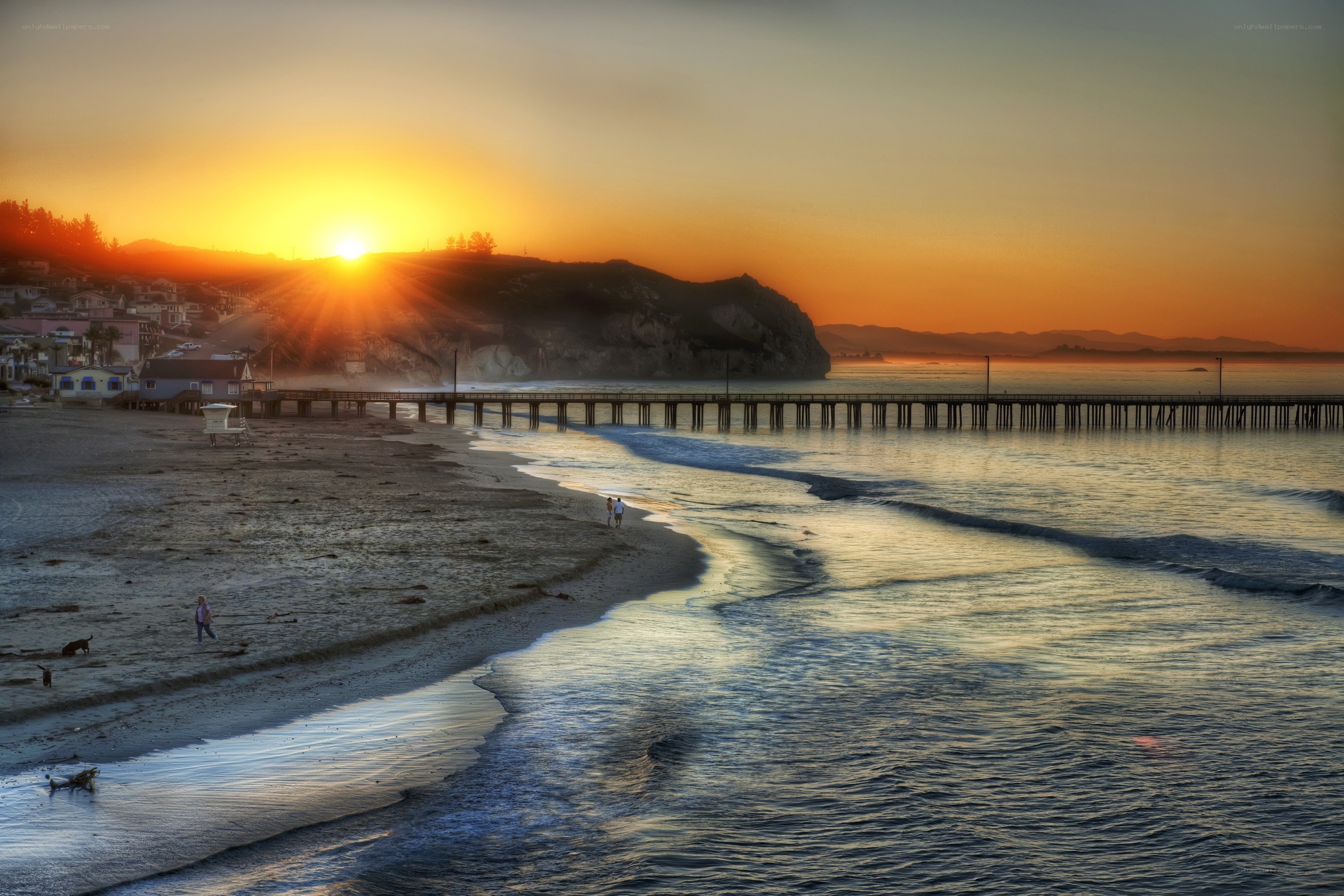 Sunset at the beach with pier