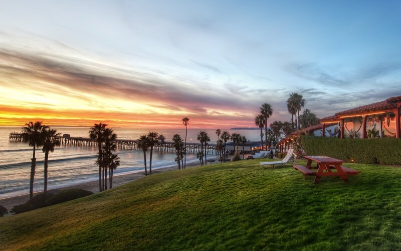 sunset at the beach with pier